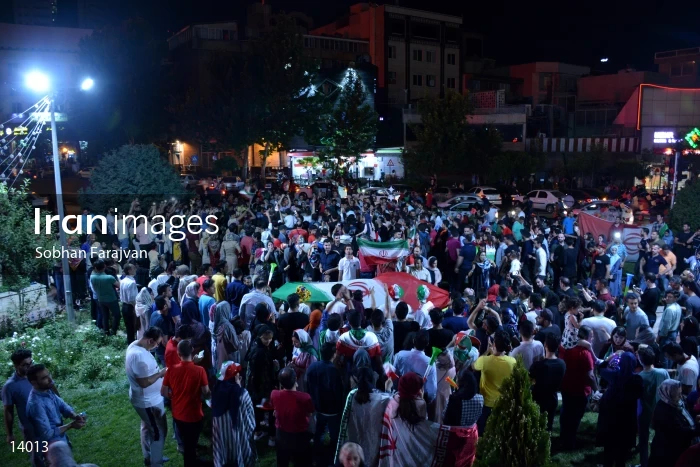 Iranian fans celebrate victory against Morocco