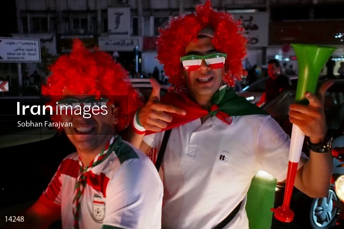 Iranian fans celebrate victory against Morocco