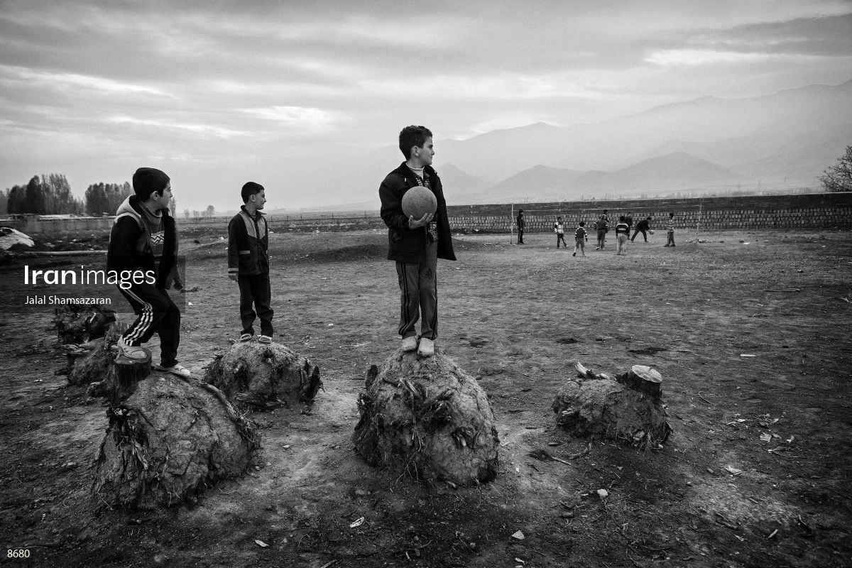 Children playing volleyball in a village near Urmia Lake