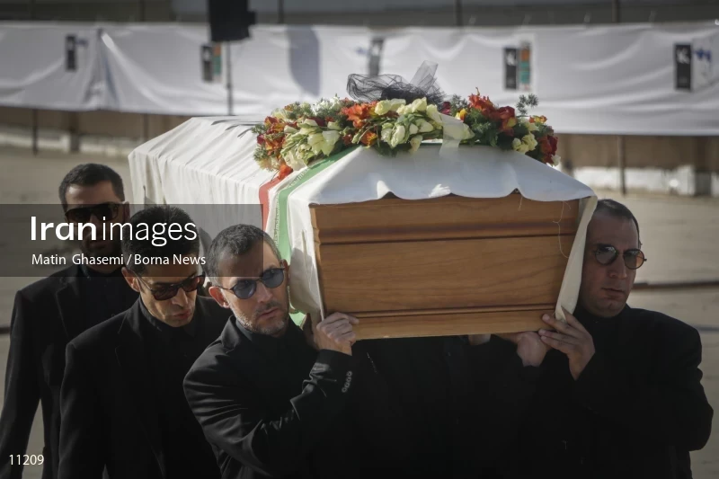 Mourners carry the coffin of Abbas Kiarostami