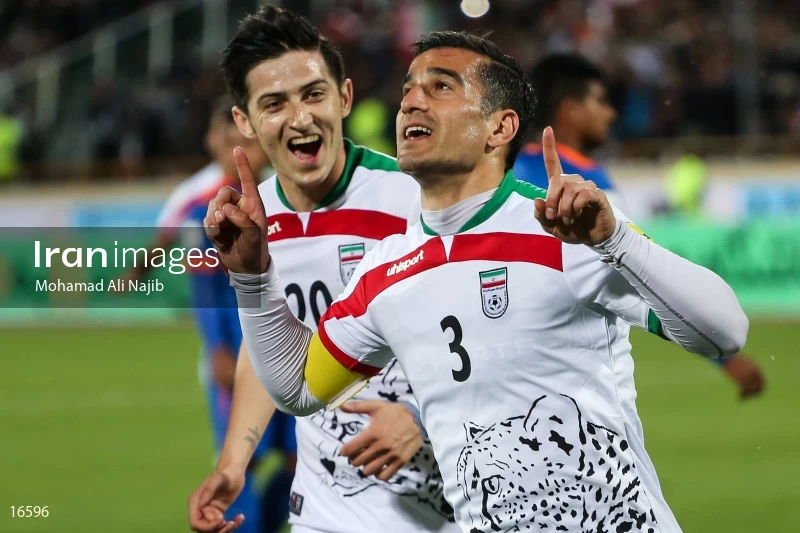 Ehsan Haj Safi and Sardar Azmoun celebrate