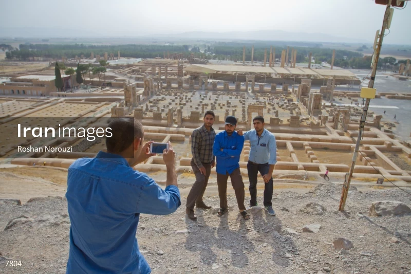Iranian youth take picture above Persepolis