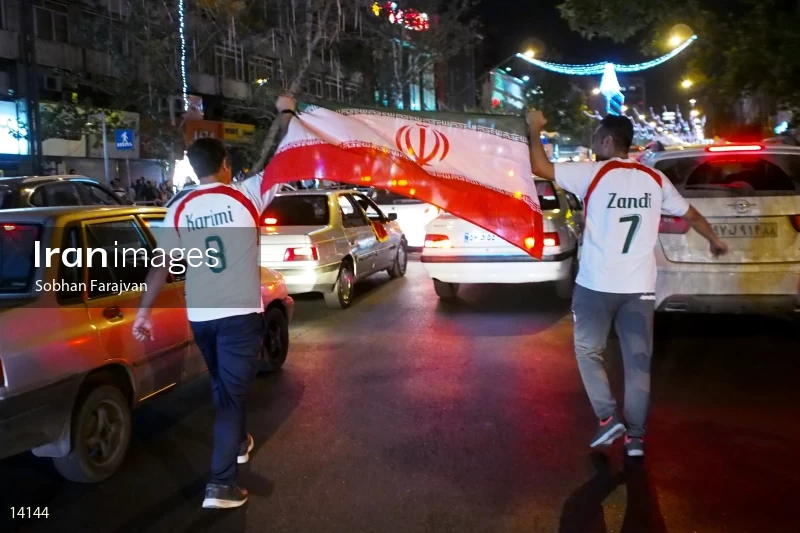 Iranian fans celebrate victory against Morocco