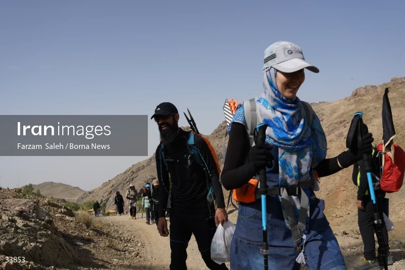 Climbing Tochal Peak with the flag of Imam Hossein (AS)