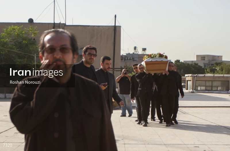 Mourners carry the coffin of Abbas Kiarostami