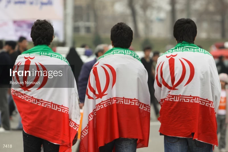 Iranian youths carry Iran flag
