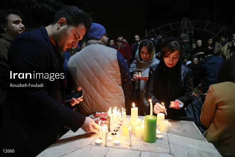 Iranians Light candle in memory of firefighters