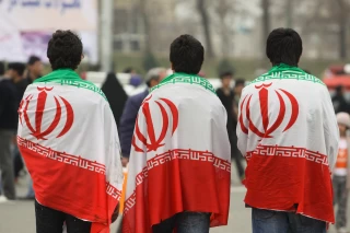 Iranian youths carry Iran flag